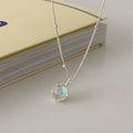 Silver necklace with geometrical ornamental stone pendant on an adjustable curb chain.
