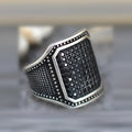 Black alloy ring with copper inlaid detailing around zircon stone in European style