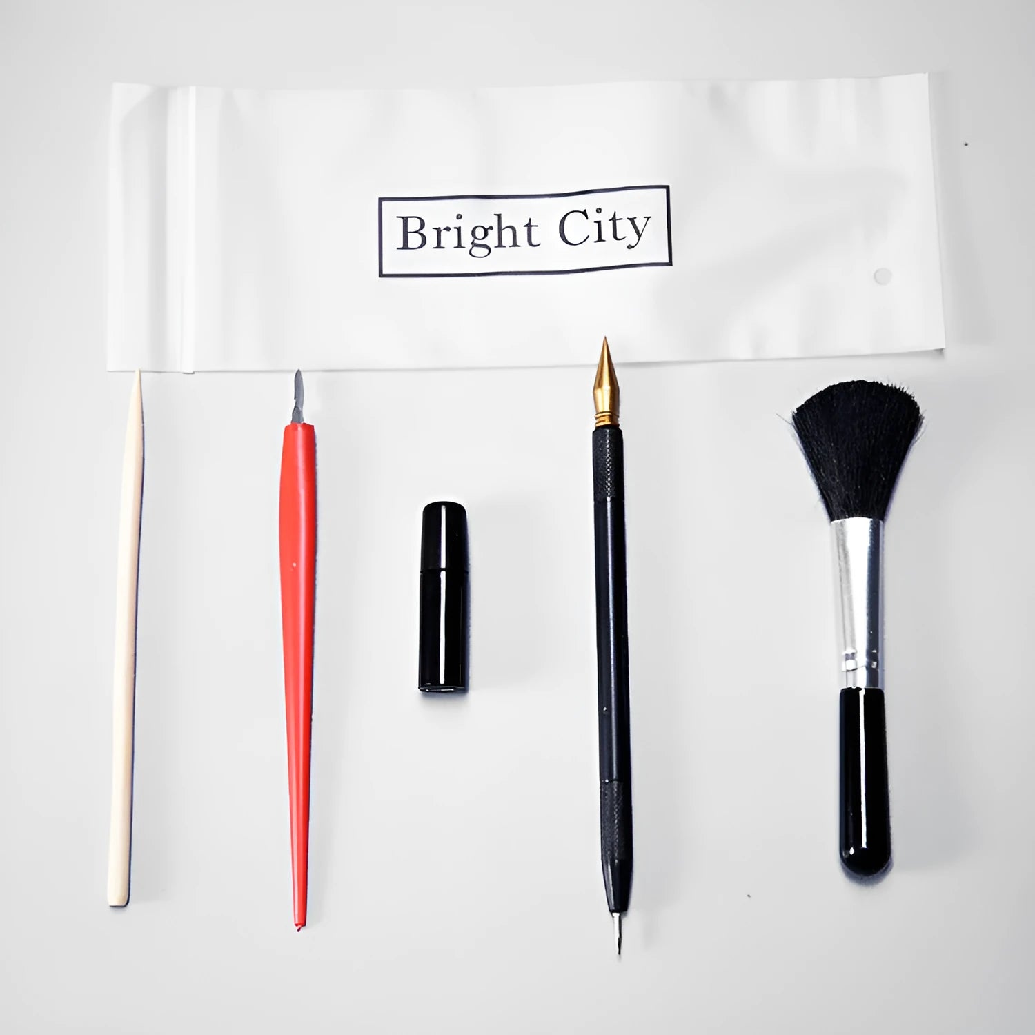Scraping painting tools kit with white card paper, scraping pens, brushes, and art accessories for scratch artwork