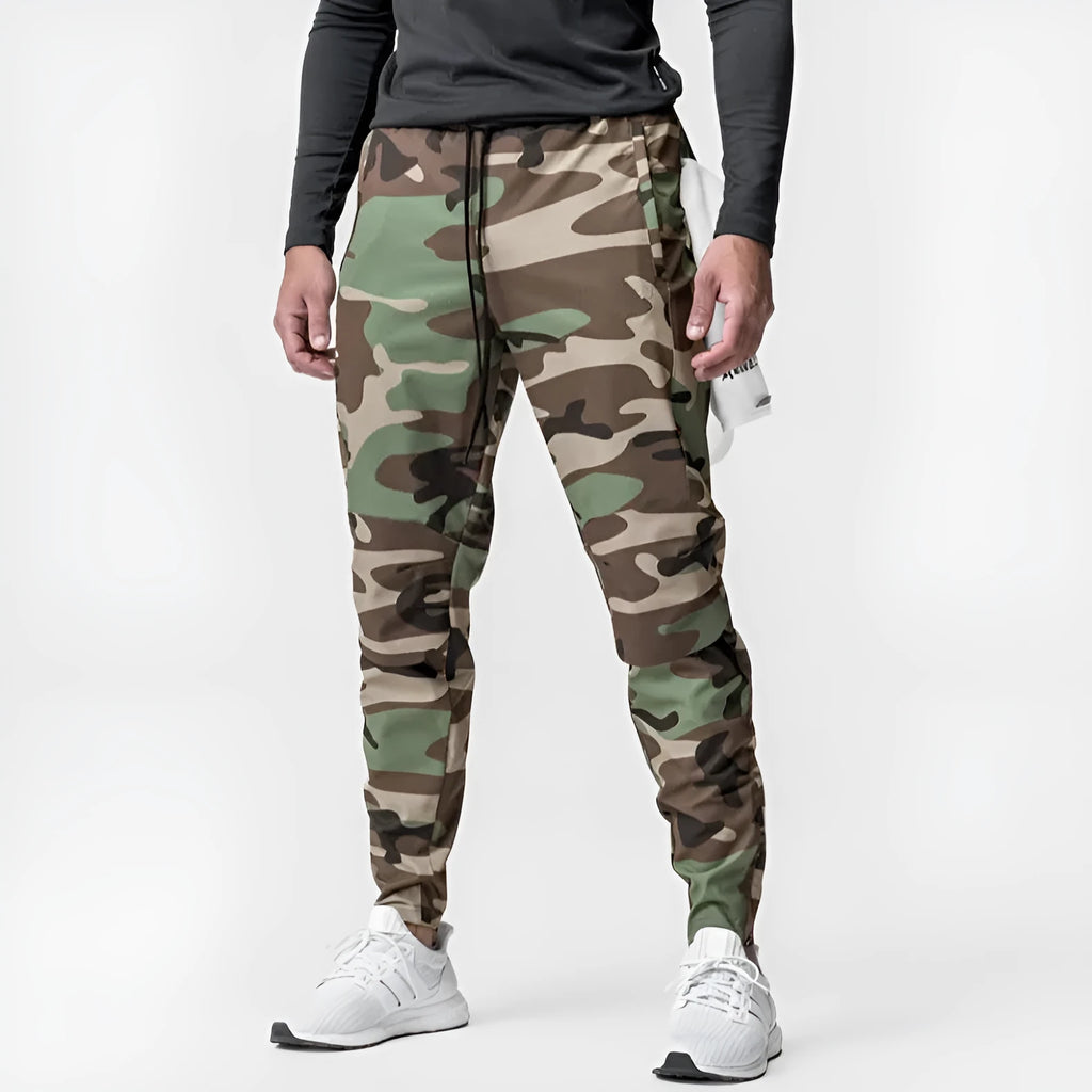 Men's loose fit quick-dry running pants with ankle ties in woodland camouflage and solid colours for gym fitness training.