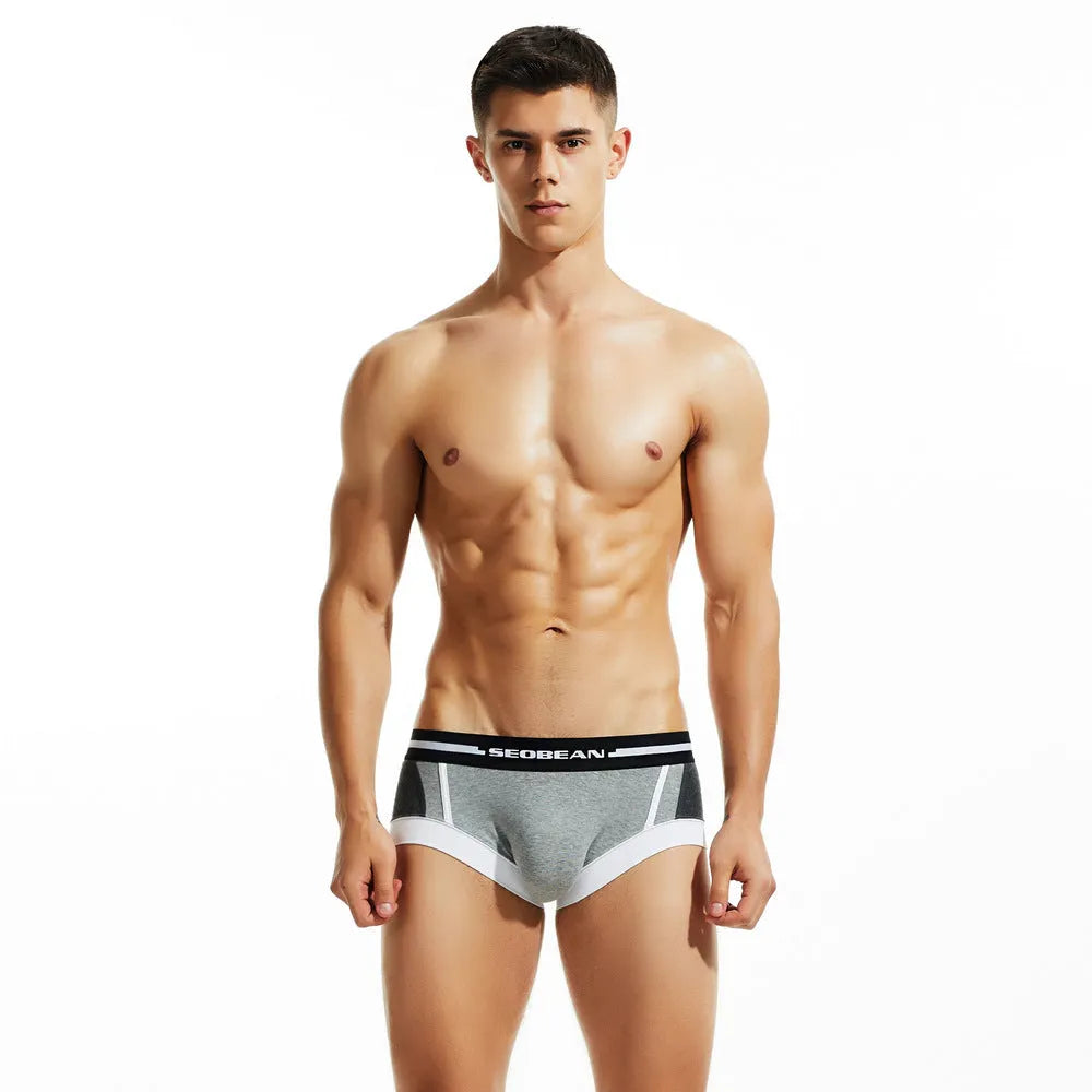 Men's red cotton low-waist boxer briefs on a plain background