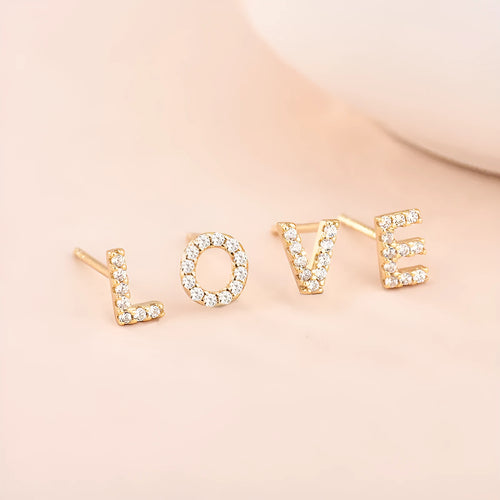 Brass gold plated alphabet letter earrings showing English character design with zircon elements