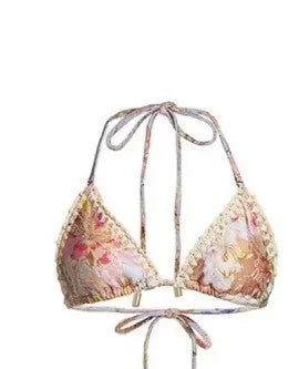 Women's creamy-white floral bikini swimsuit set with skirt, top, and briefs in nylon fabric