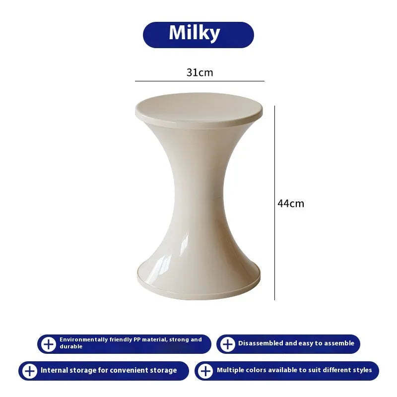 Green plastic hourglass-shaped shoe changing stool for children and adults