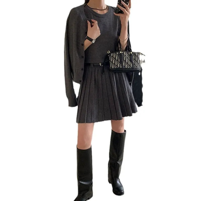 Women's grey vest skirt and cardigan two-piece set with belt and pleated details