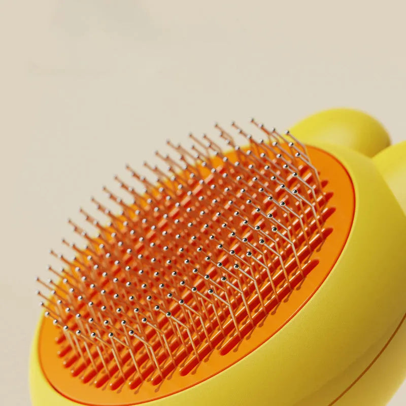 Self-cleaning pet grooming brush with release button and stainless steel comb in assorted colours