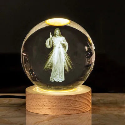 White crystal lamp with 6cm diameter orb on solid wood warm light base showing religious ornamentation