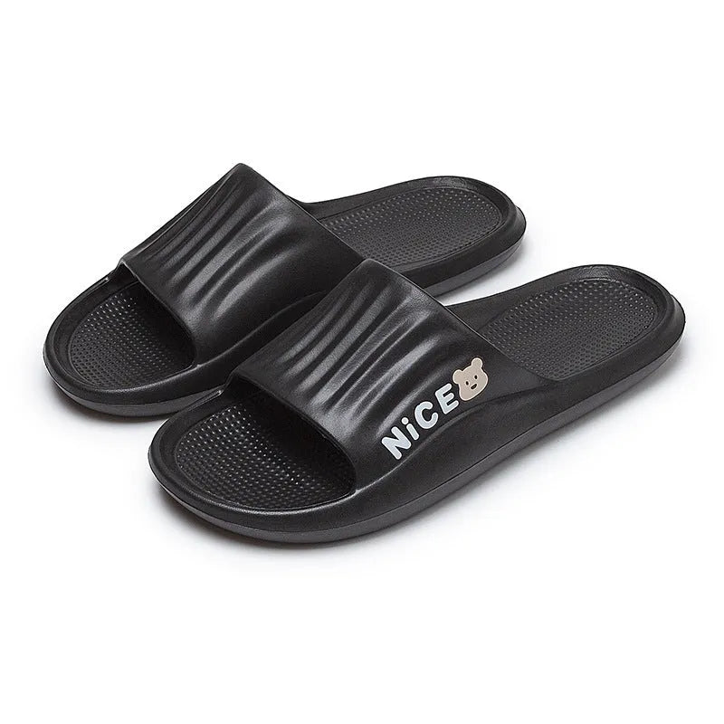 Pair of minimalist EVA flip flop slippers in a choice of six colours, showing the injection moulded non-slip sole.