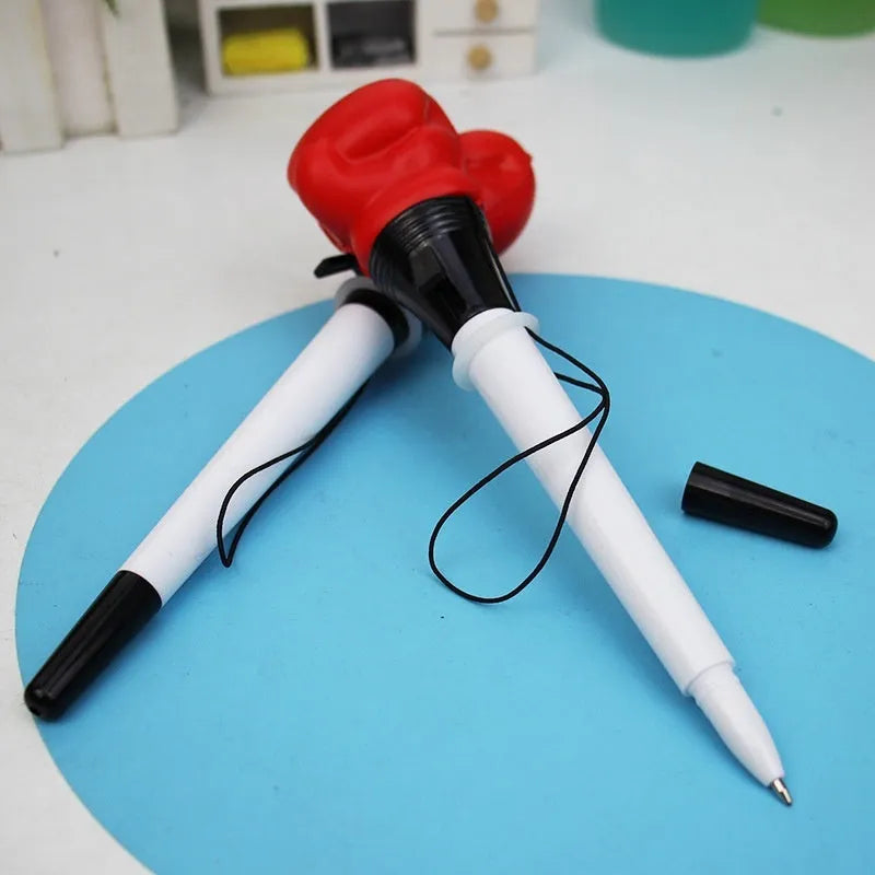 Boxing press ejection pen set showing four pens with plug-in sleeve mechanism and 0.7mm bullet-shaped tips