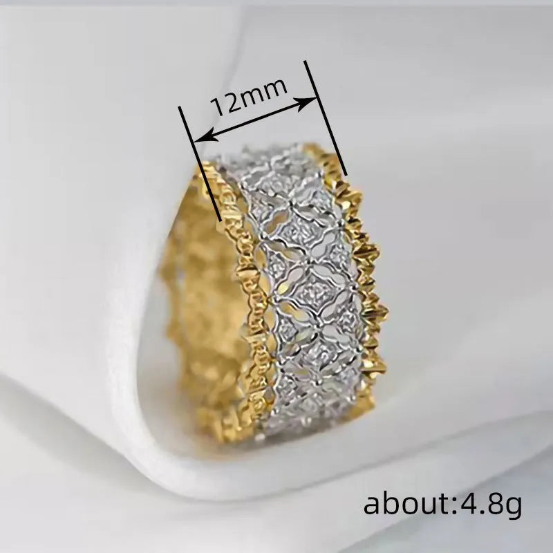 Geometric two-tone gold zircon ring on a copper band, shown in a side view.