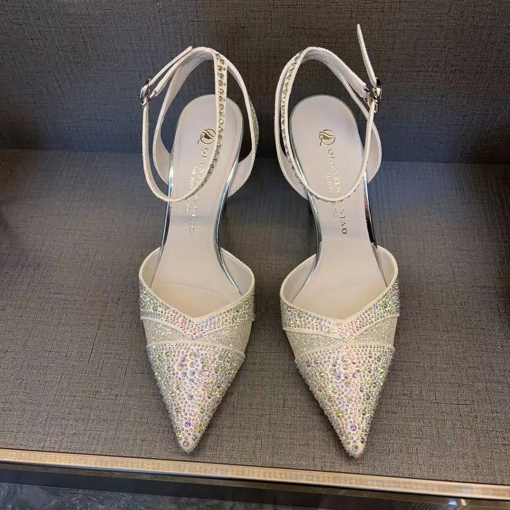 Women's silver and black hollow high heels with red sole and pointed toe design