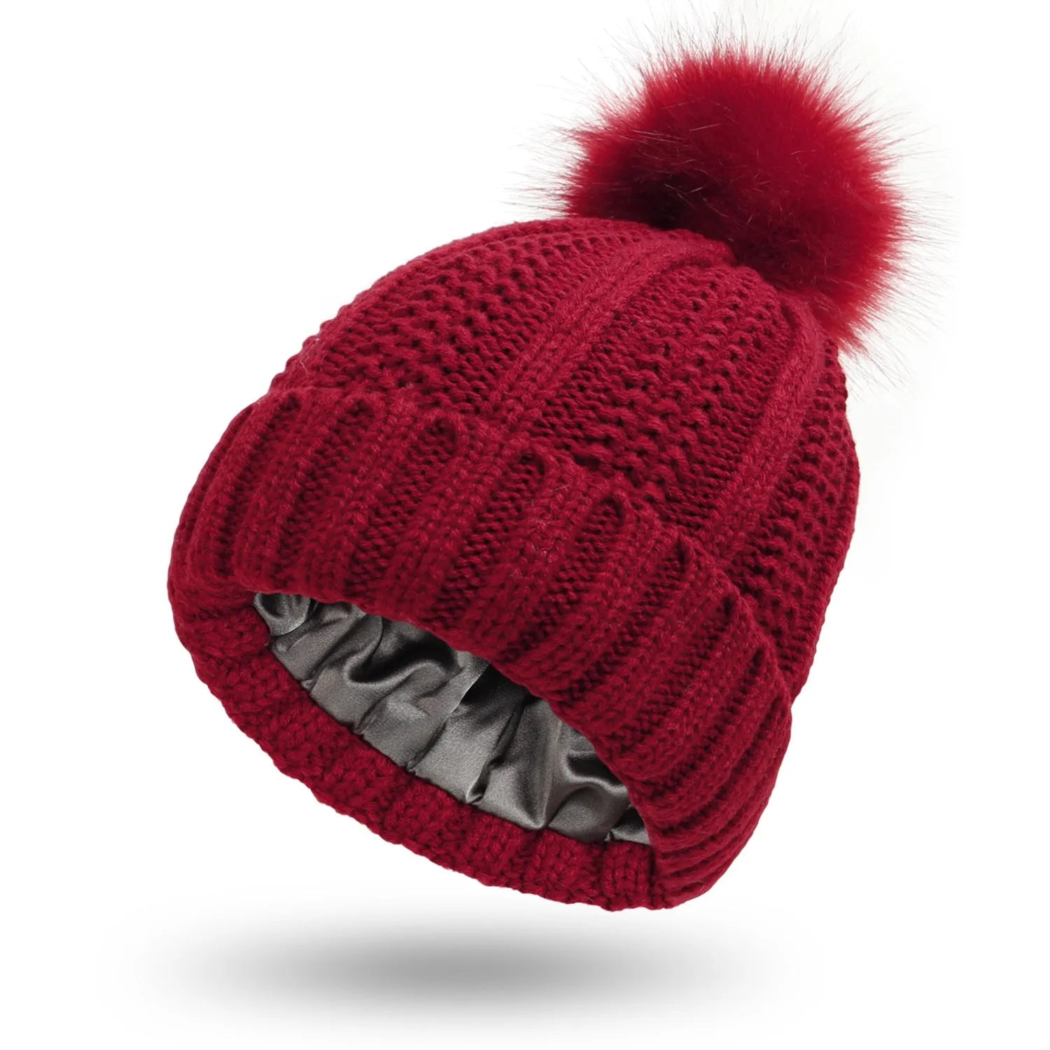 Wool knitted beanie hat with satin lining and faux fur pom pom in beige colour