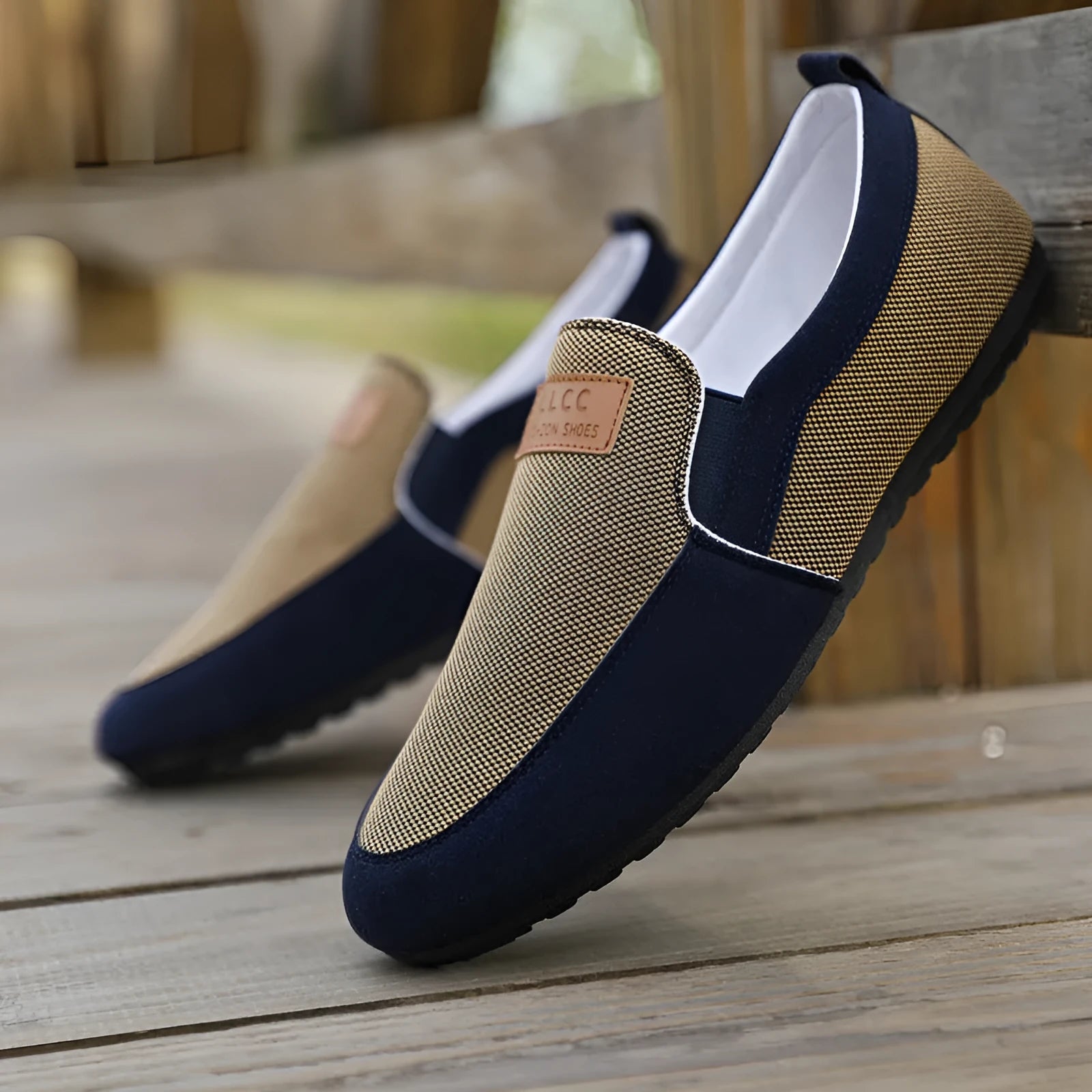 Men's grey and khaki canvas casual shoes with a round toe and rubber sole.