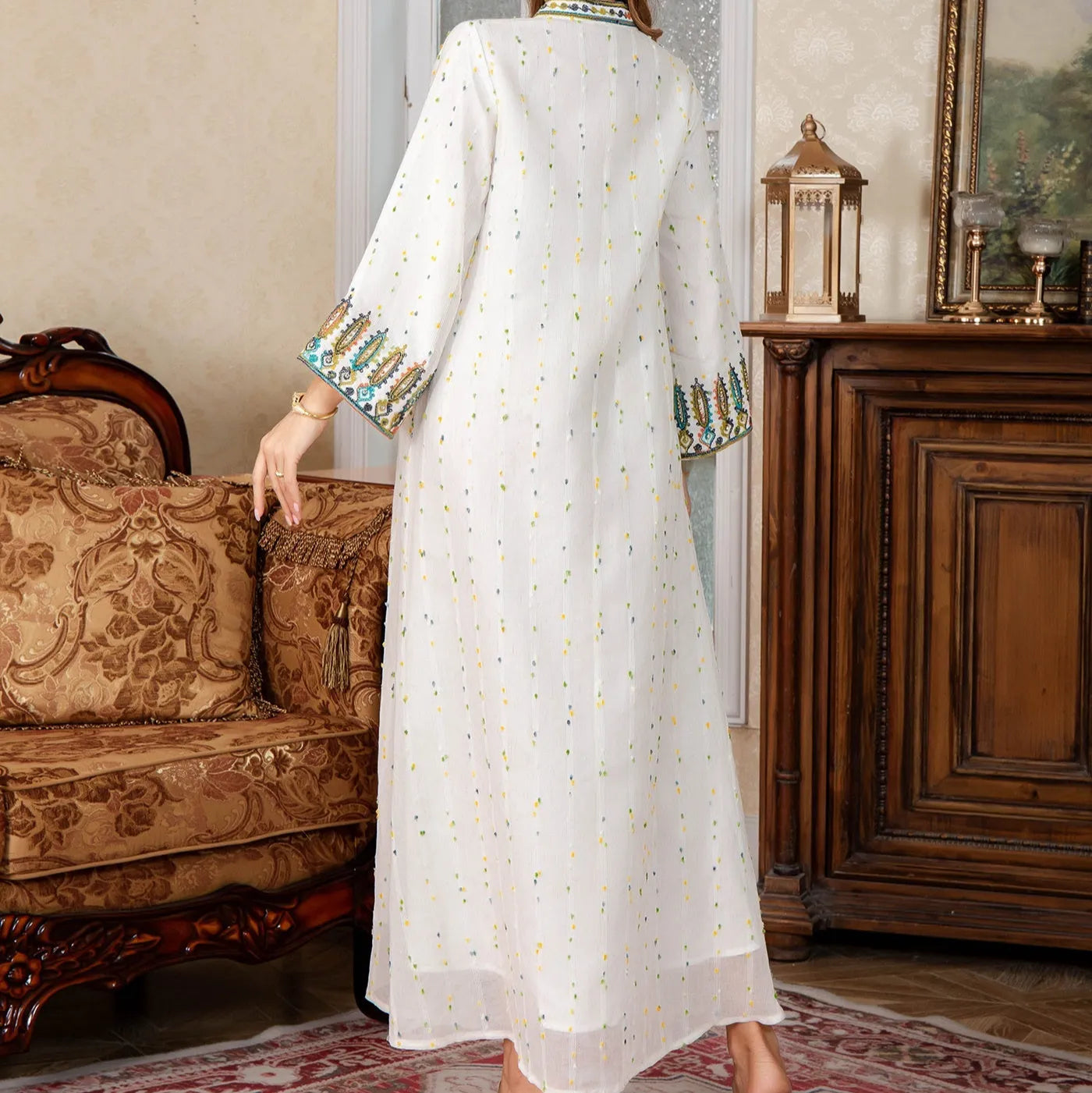 White long sleeve, long skirt Arabic robe for women on a hanger.