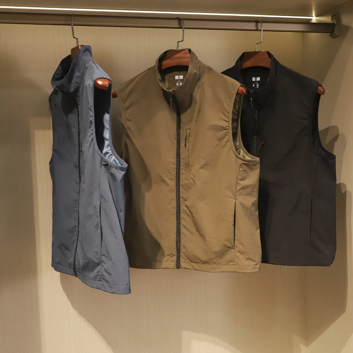 Men's thin nylon vest cardigan in army green with side pockets and straight retro cut.