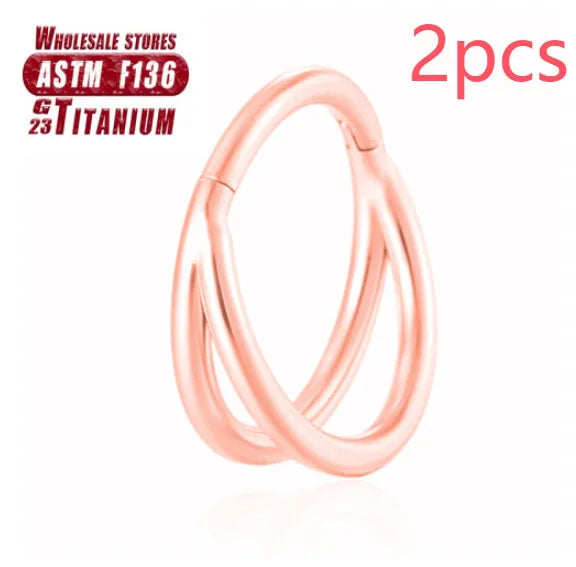 Titanium alloy fork nose ring in silver colour on a plain background, showing its shape and size.