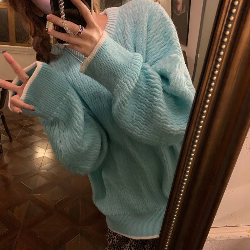 Women's loose polyester pullover sweater in lake blue, shown with regular sleeves and solid colour design.