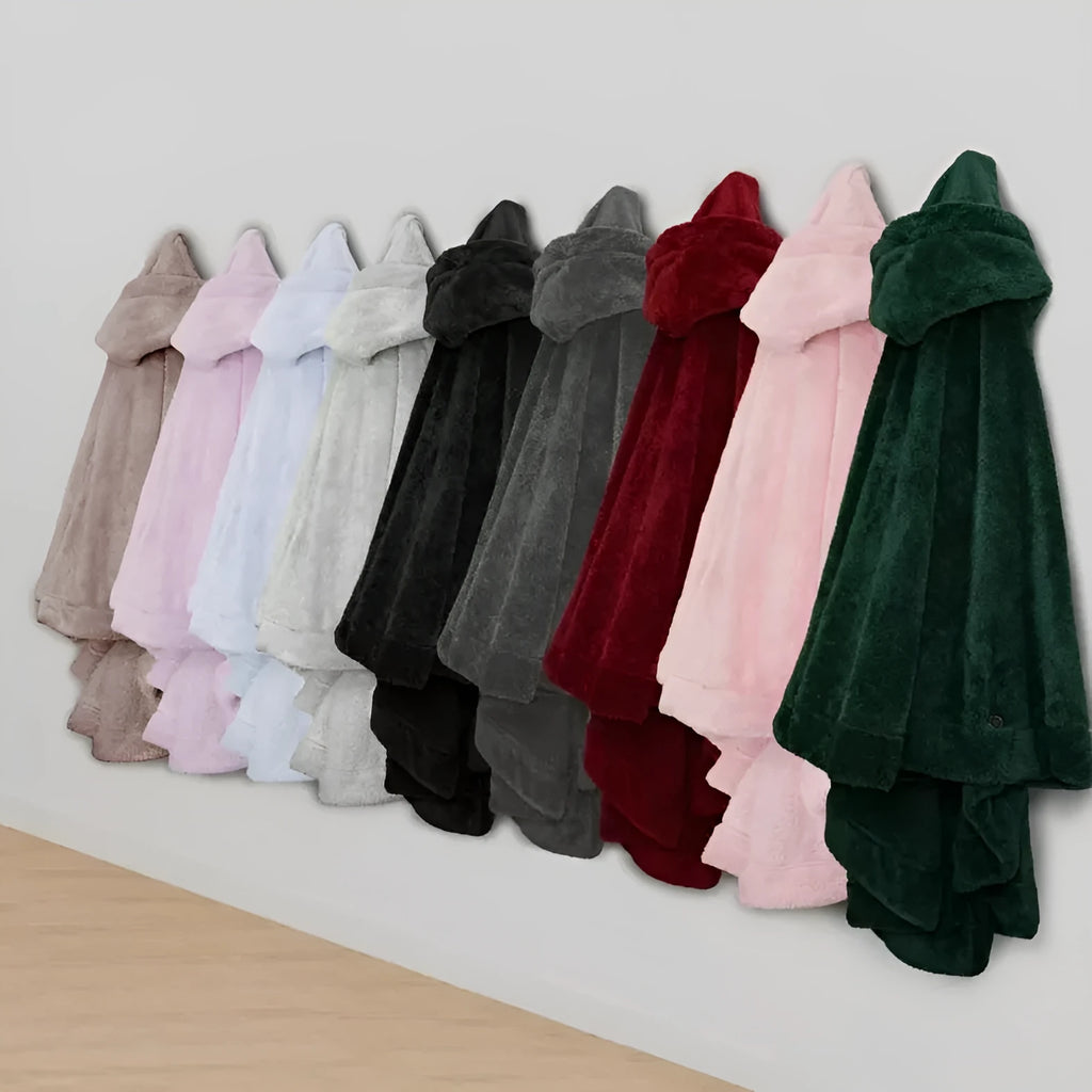 Thick hooded long sleeve bathrobe in black hanging on a hook