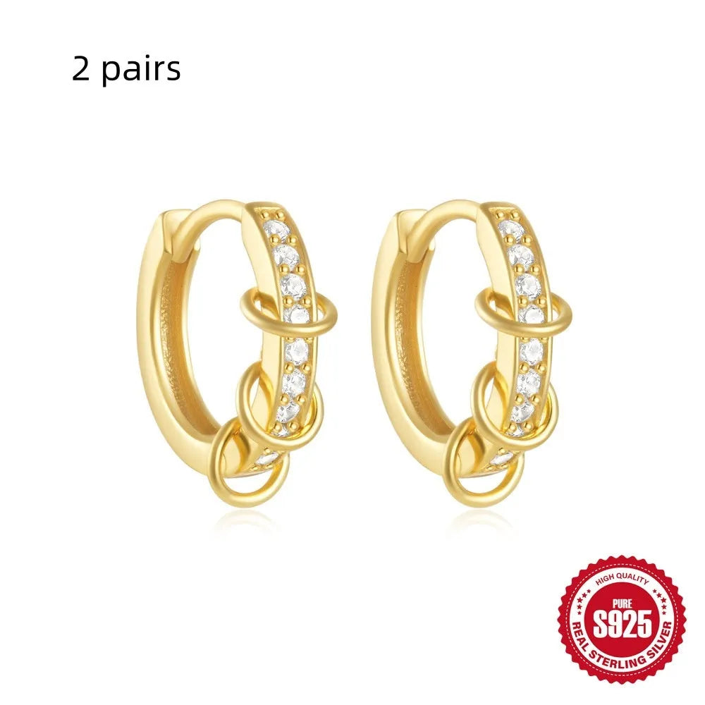 Small round geometric sterling silver stud earrings with a diamond shape, available in gold or silver finish.