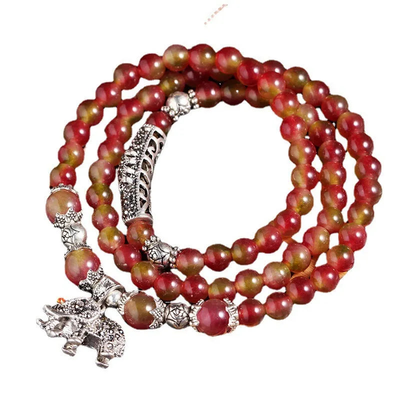 Watermelon crystal bracelet with Chinese knot detailing in geometric national style design