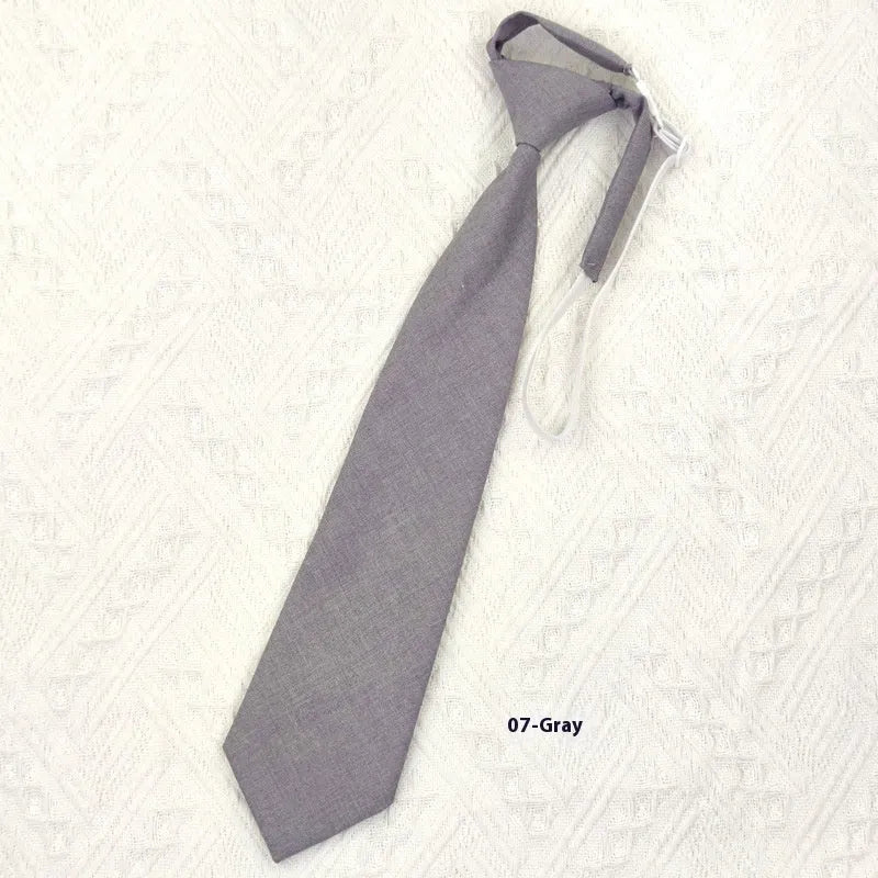 Men's navy blue cotton bow tie with arrow-style design on a white background.