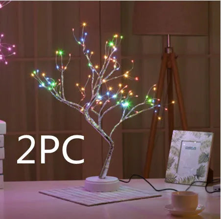 White LED Christmas tree shaped night light with touch base, standing 50cm tall on a table.