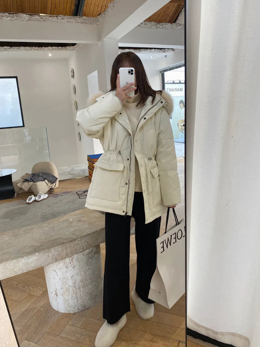 Women's high waist wide-leg knit trousers in cream white colour, laid flat to show straight-leg cut.