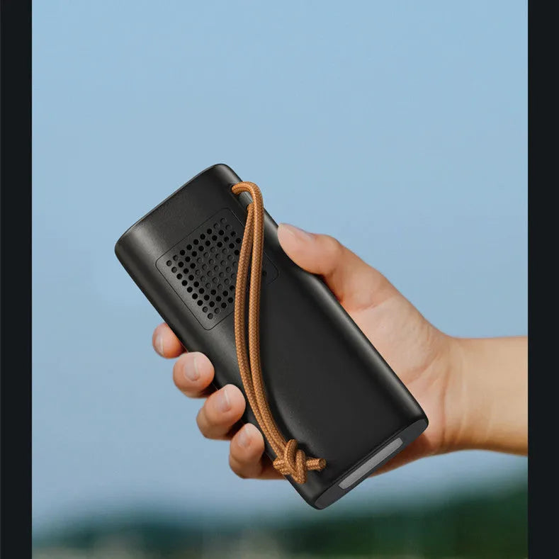 Black portable power bank with solar panel and multiple charging ports