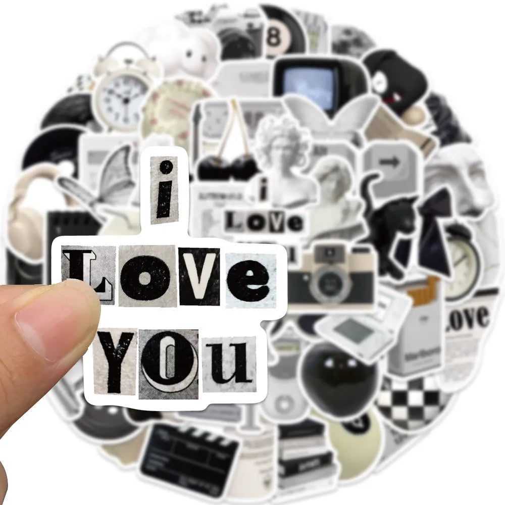61-piece black and white waterproof PVC sticker set for laptops, phones, and luggage.