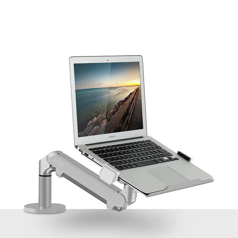 Silver aluminium alloy laptop stand with air pressure arm bracket on desktop