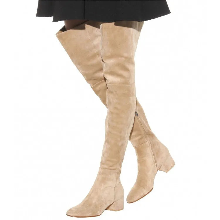 Women's grey suede over-the-knee flat boots with a pointed toe and thick low heel.