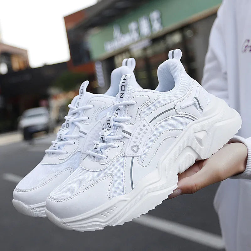 Women's white chunky casual sports shoes with mesh upper and thick mid-heel sole.