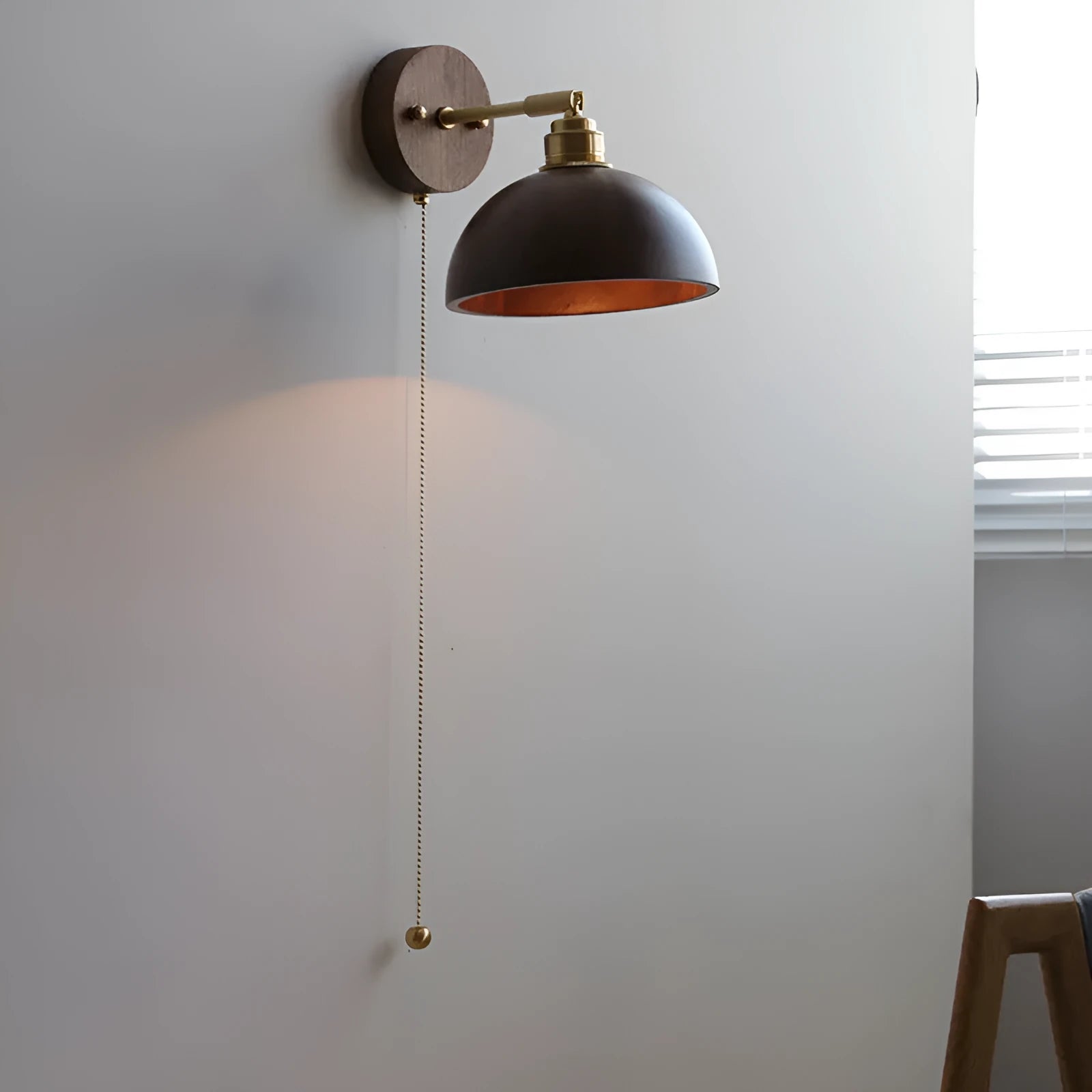 Nordic-style wooden wall lamp mounted beside a bed, shown in walnut brown and natural wood colour options.