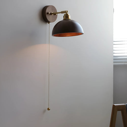Nordic-style wooden wall lamp mounted beside a bed, shown in walnut brown and natural wood colour options.