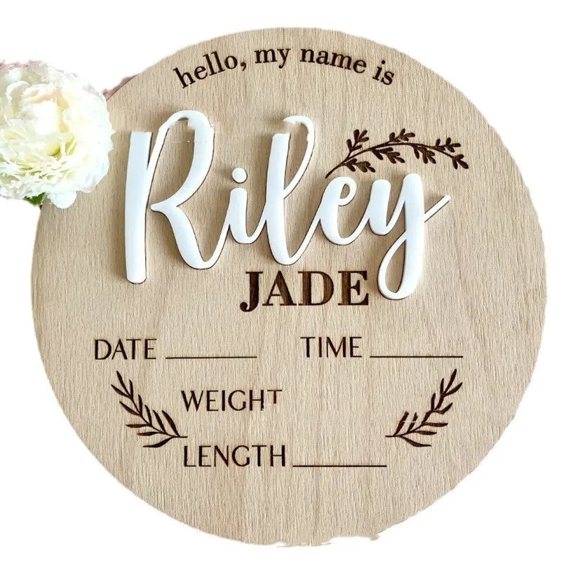 Square wooden baby birth announcement plaque showing newborn name and details