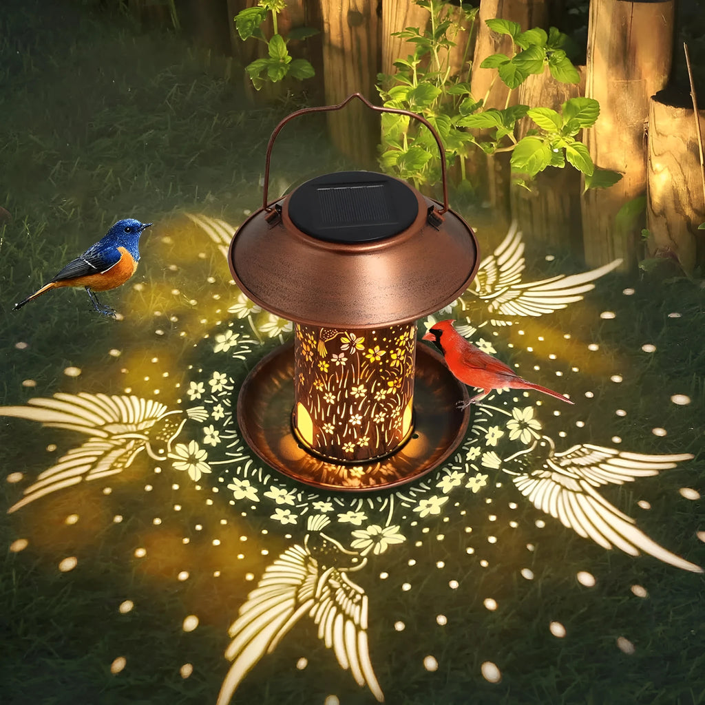 Solar-powered iron art bird feeder lamp with hummingbird pattern for outdoor gardens.