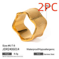 A women's stainless steel ring with a wide, sculptural geometric wave design and an electroplated silver-toned finish.
