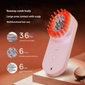 Pink and black smart massage comb with red light therapy for hair care, measuring less than 10cm