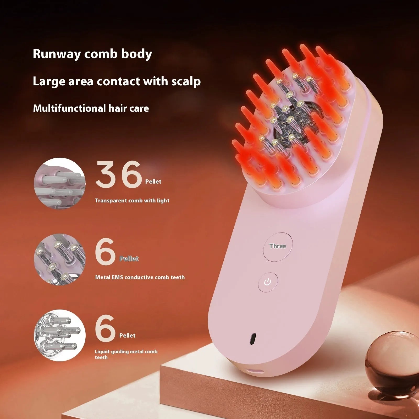 Pink and black smart massage comb with red light therapy for hair care, measuring less than 10cm