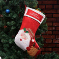 Christmas sock pendant decorations showing elk, Santa, and snowman motifs