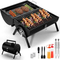 Small foldable charcoal barbecue stove with grill attachment on desktop