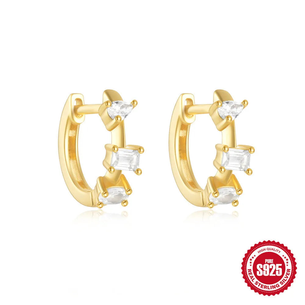 Small round geometric sterling silver stud earrings with a diamond shape, available in gold or silver finish.