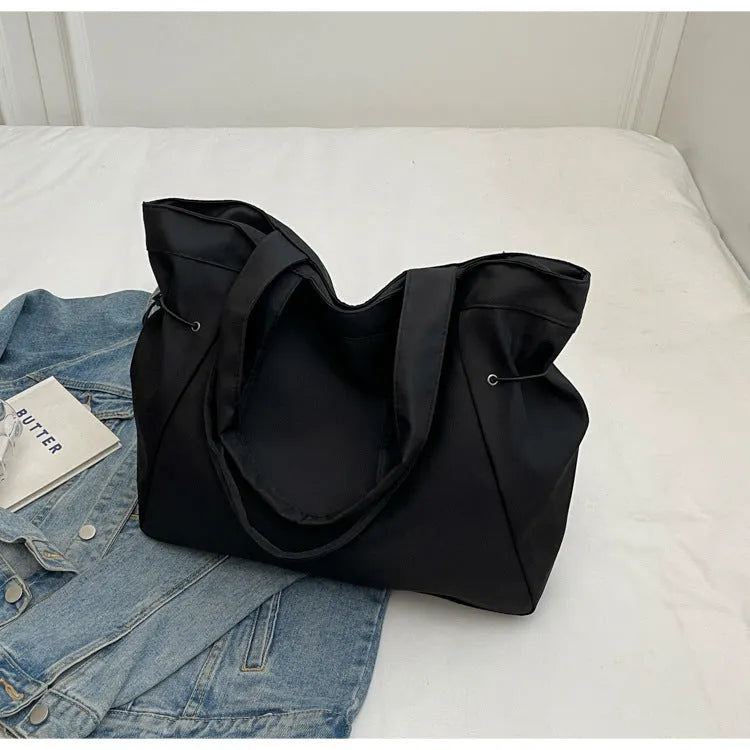 Soft Oxford cloth foldable commuter tote bag in street style, shown in multiple colour options.