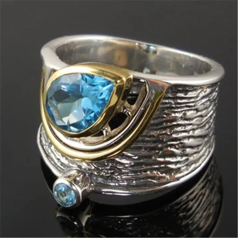 Chinese style women's blue zircon ring with drop shape design and inlaid detailing