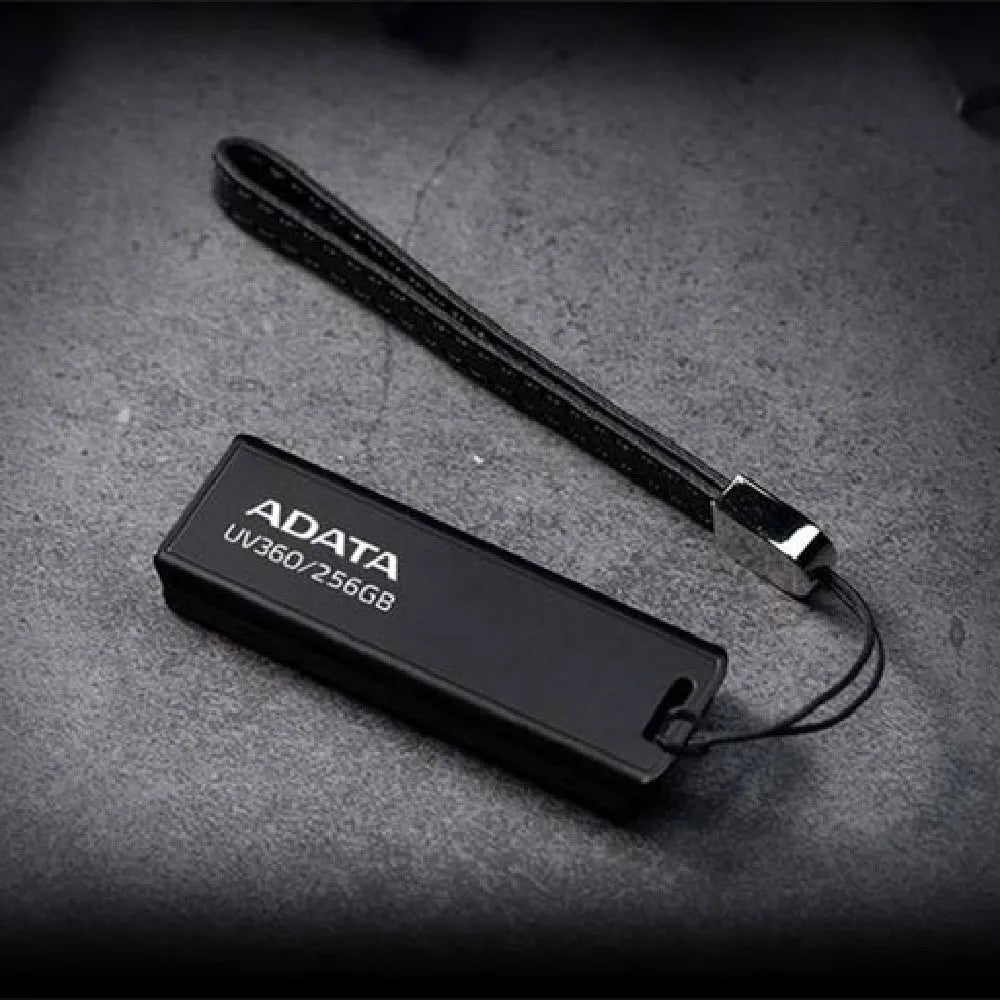 Black car USB flash drive showing compact dimensions and USB 3.2 connector