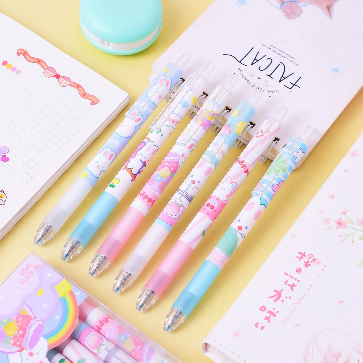 Six cartoon bunny design black ink pens with 0.5mm tips arranged together