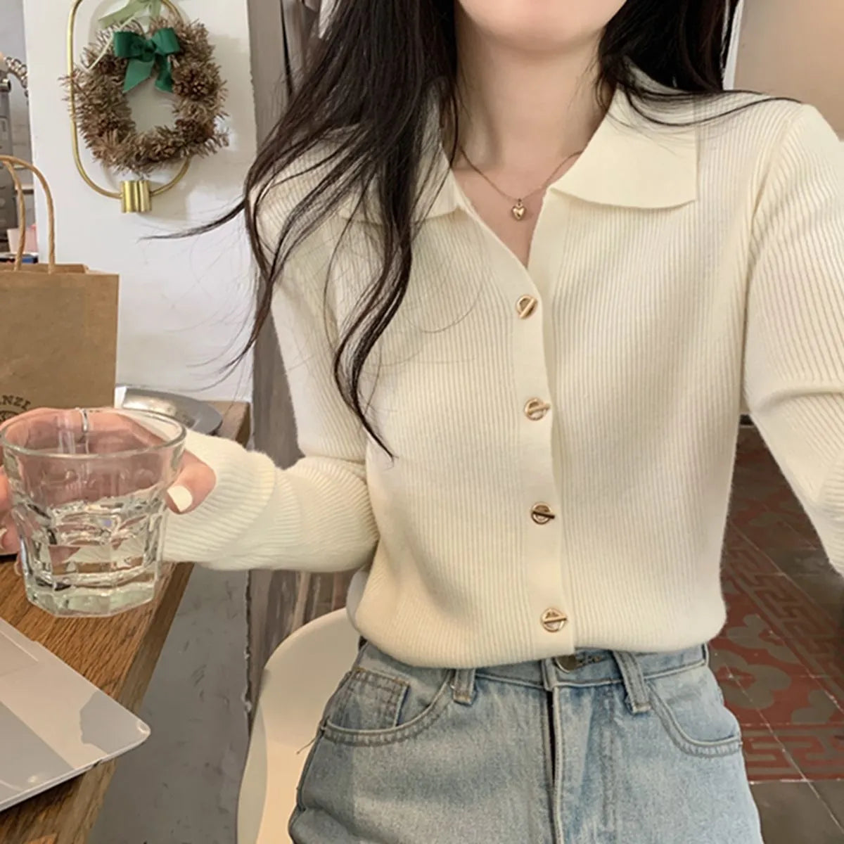 Loose fit beige viscose knitted cardigan with long sleeves, shown worn open.