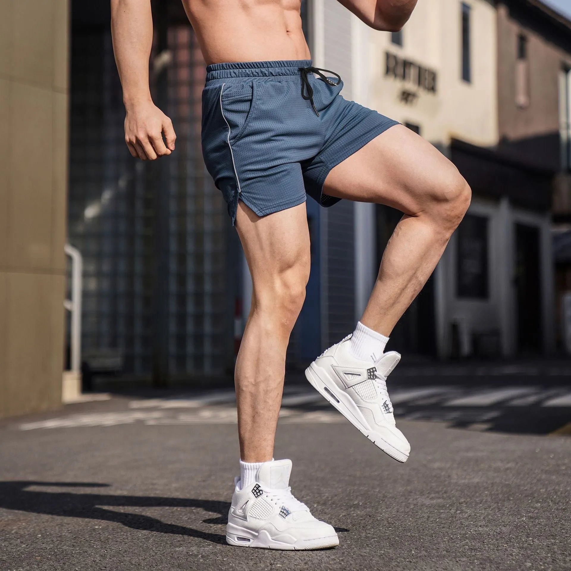 Men's straight-fit polyester athletic shorts in black, grey, navy blue, or red for sports and fitness