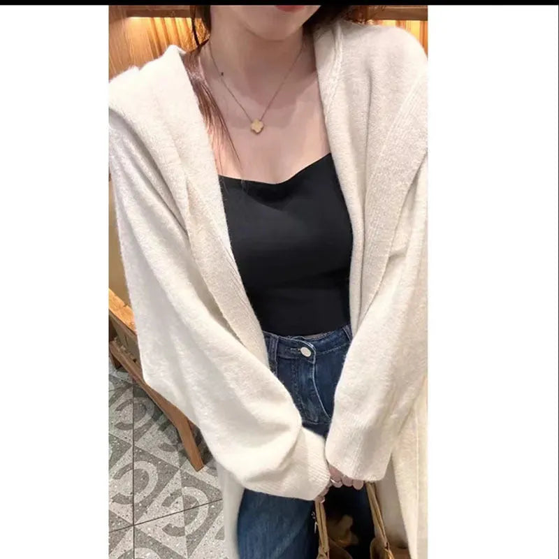 Women's long hooded cardigan in wool blend fabric showing below-the-knee length and loose fit silhouette