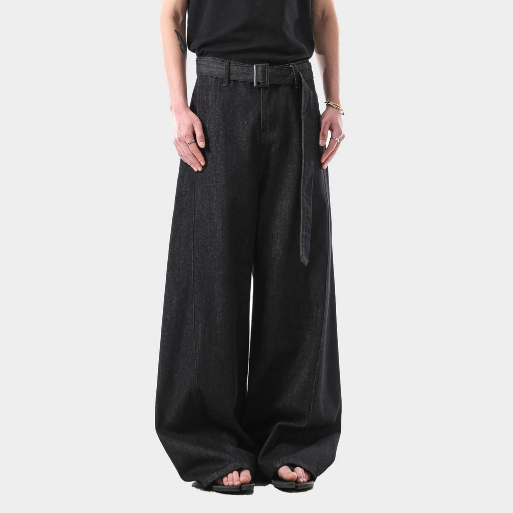 Black high waist straight leg denim jeans on a neutral background.